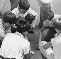 Boys playing cards in 1935, from the Library of Congress collection.